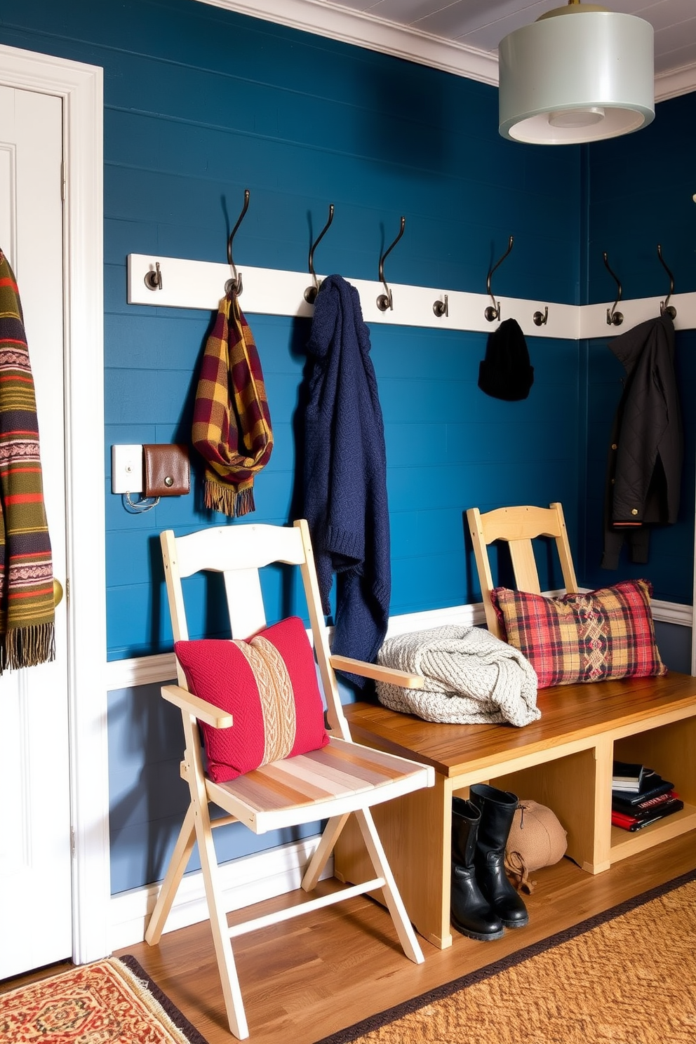 A cozy winter mudroom features folding chairs arranged against the wall for extra seating. The walls are adorned with hooks for winter coats and a bench with storage underneath for boots and accessories.