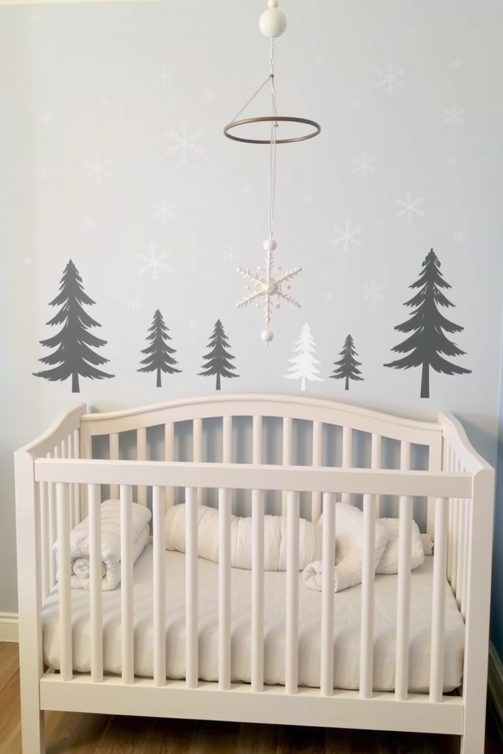 Winter themed wall decals featuring snowflakes and pine trees create a cozy atmosphere in the nursery. Soft pastel colors and playful designs add a touch of whimsy to the space. For a winter nursery, incorporate plush blankets and cushions in shades of icy blue and white. A mobile with hanging snowflakes and stars can enhance the enchanting winter wonderland theme.