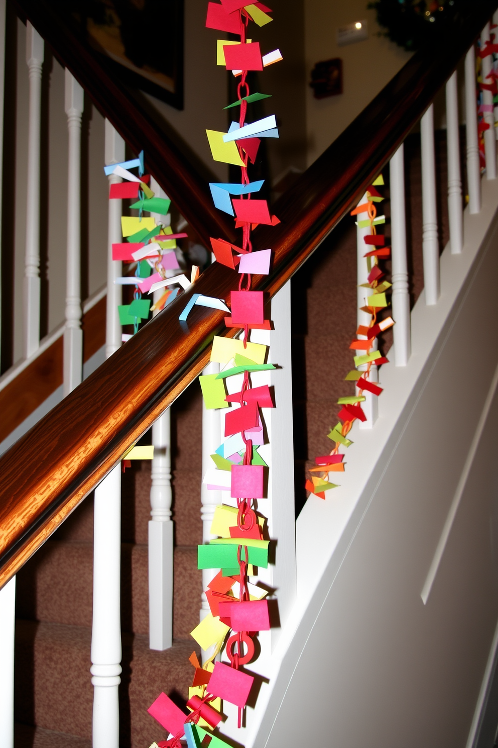 Colorful paper chains are draped elegantly along the railing of a staircase. The vibrant hues create a festive atmosphere, enhancing the winter decor with a playful touch.